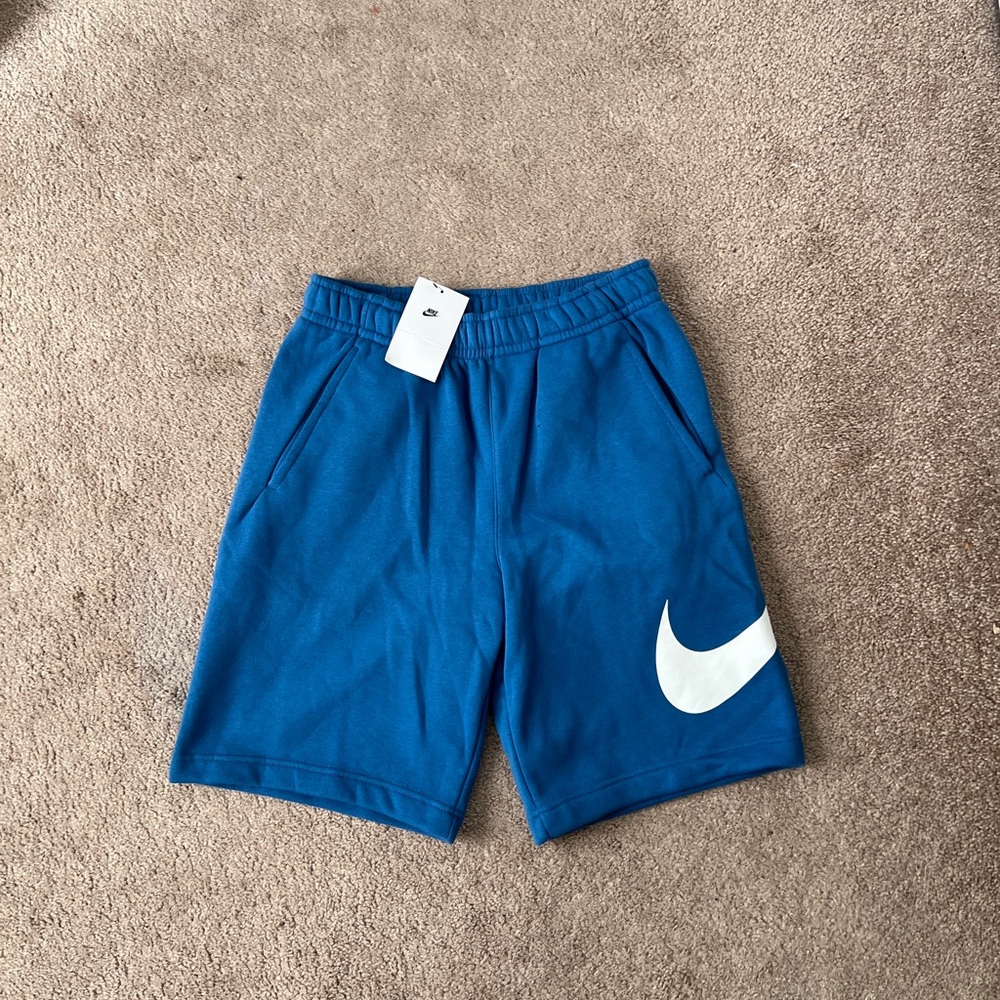 Blue Athletic Shorts with White Swoosh